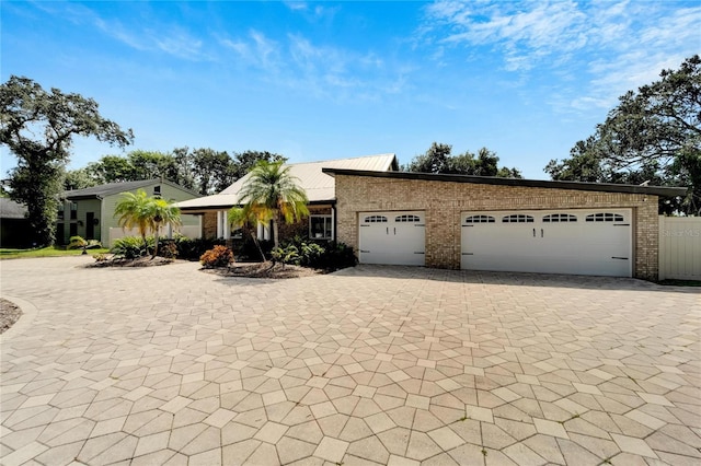 single story home with a garage