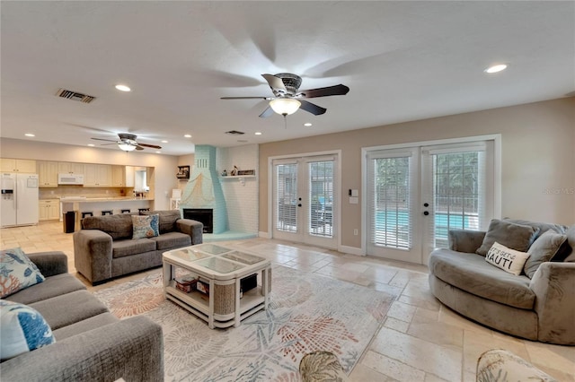 living room with french doors and ceiling fan