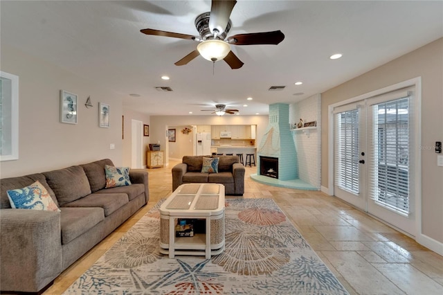 living room with ceiling fan and french doors