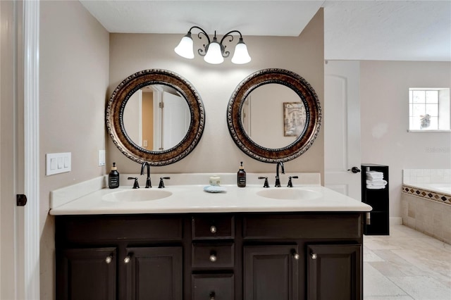 bathroom featuring a relaxing tiled tub and vanity