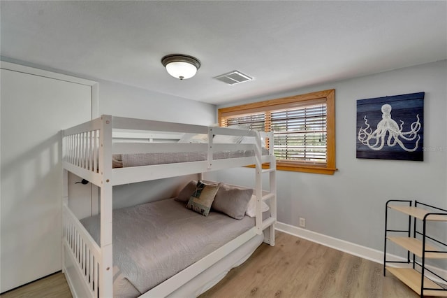 bedroom with light wood-type flooring