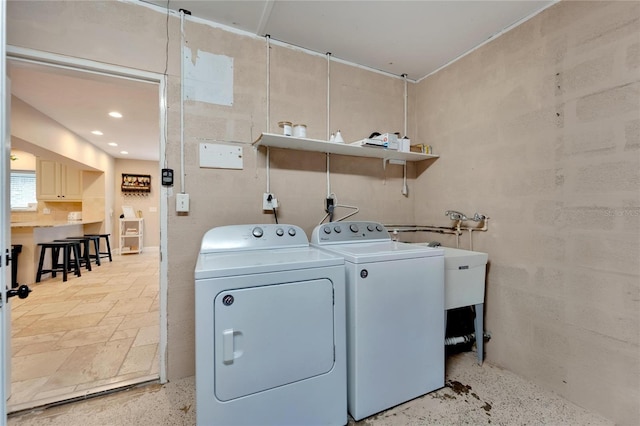 laundry area with washing machine and clothes dryer