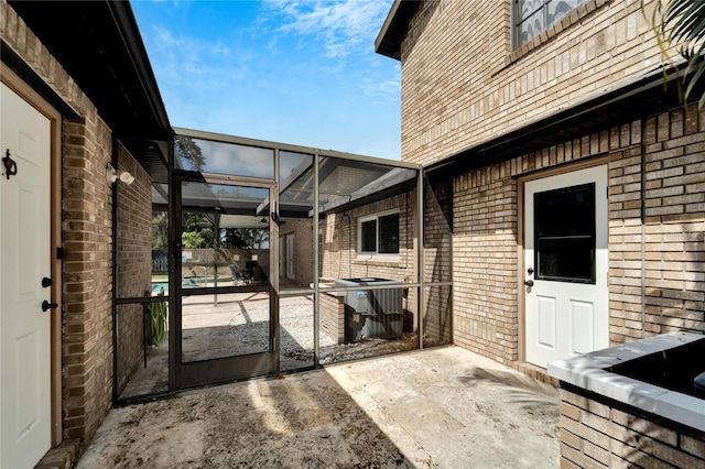 view of patio with a lanai