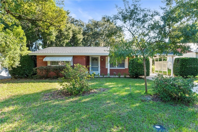 ranch-style house with a front yard