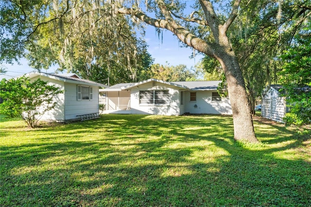 back of house with a yard