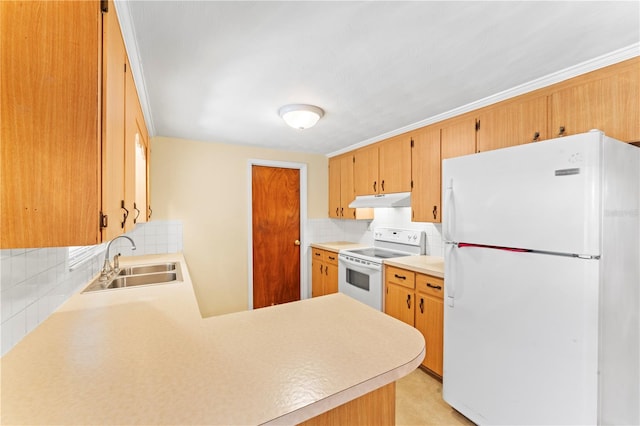 kitchen featuring white appliances, kitchen peninsula, sink, and backsplash