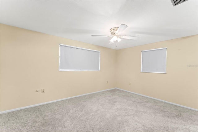 unfurnished room featuring ceiling fan and light colored carpet