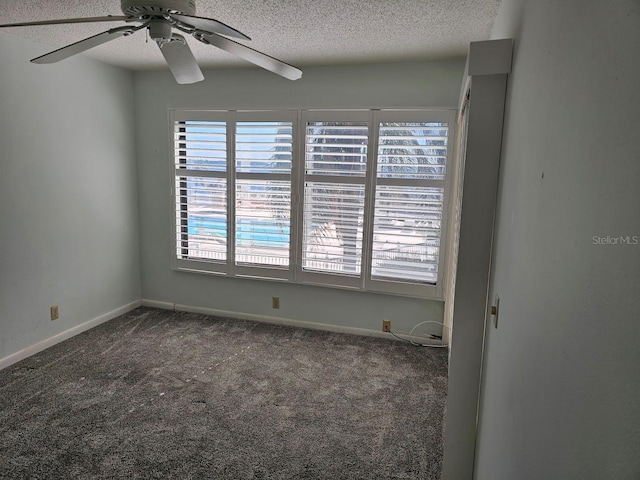 spare room with ceiling fan, a textured ceiling, a healthy amount of sunlight, and carpet flooring