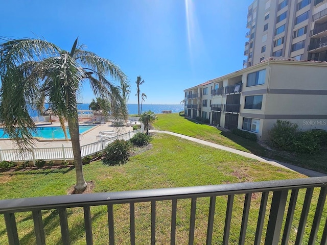 view of community with a lawn and a pool