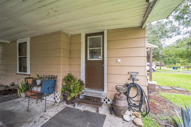 property entrance with a yard