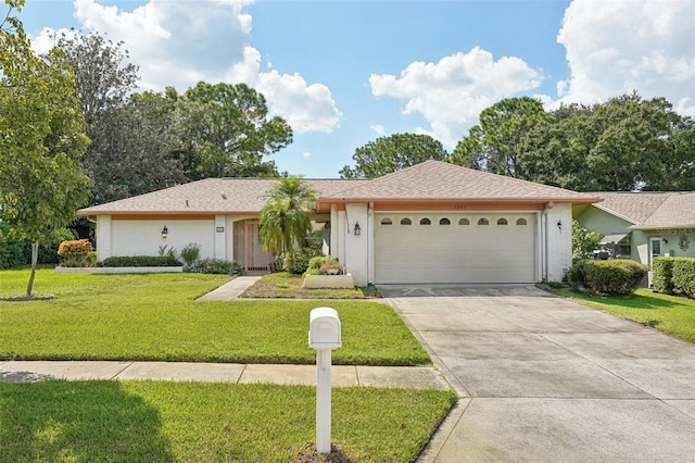 single story home featuring a garage and a front yard