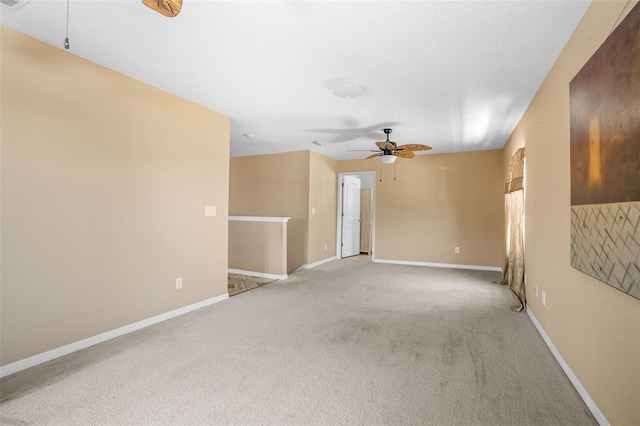 empty room with light carpet and ceiling fan