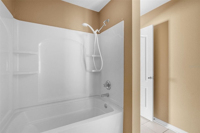 bathroom featuring tile patterned flooring and shower / bath combination