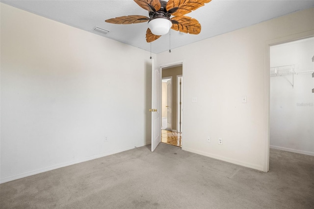 unfurnished bedroom with a closet, ceiling fan, and light colored carpet