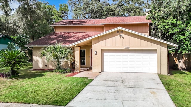 view of front of house featuring concrete driveway, an attached garage, stucco siding, and a front lawn
