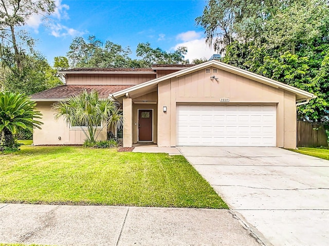 single story home with a front lawn and a garage