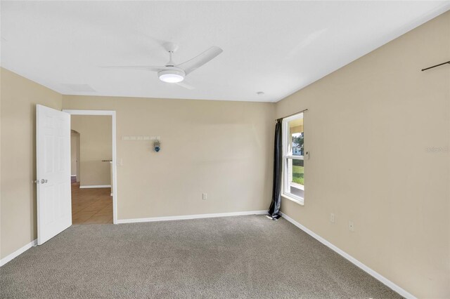 carpeted empty room with ceiling fan