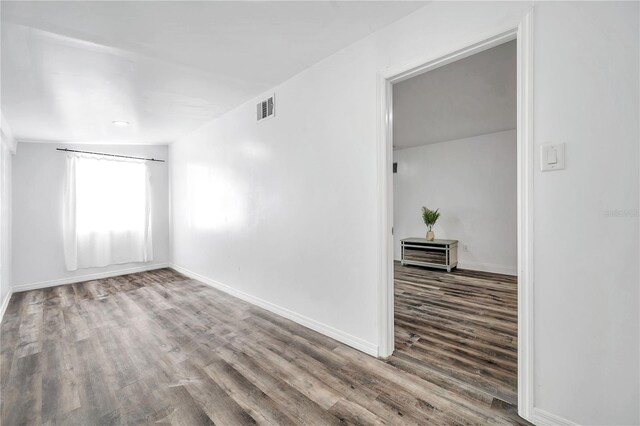 unfurnished room featuring wood-type flooring