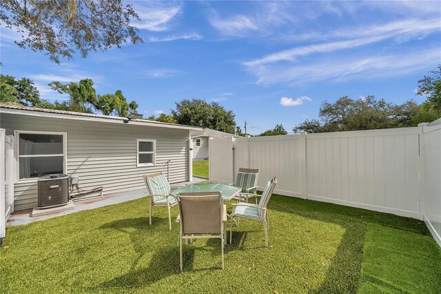 view of yard featuring a patio and central AC unit