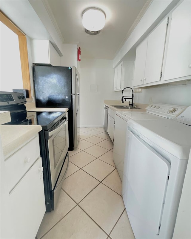 kitchen with light tile patterned floors, stainless steel electric stove, sink, and white cabinetry