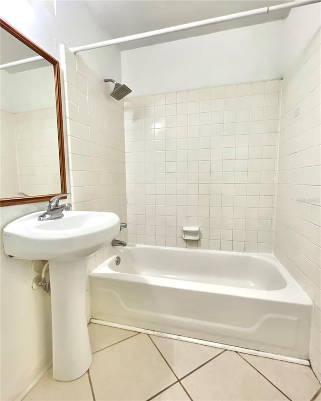 bathroom with tile patterned flooring and tiled shower / bath combo