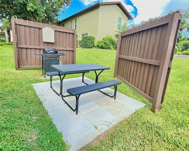 exterior space featuring a patio and a yard