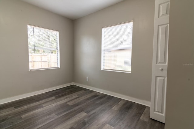 empty room featuring dark hardwood / wood-style floors