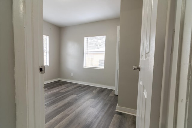 empty room featuring dark hardwood / wood-style flooring