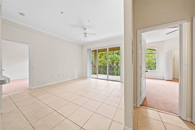 carpeted empty room with ornamental molding and ceiling fan