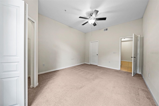 unfurnished bedroom with ceiling fan and carpet flooring