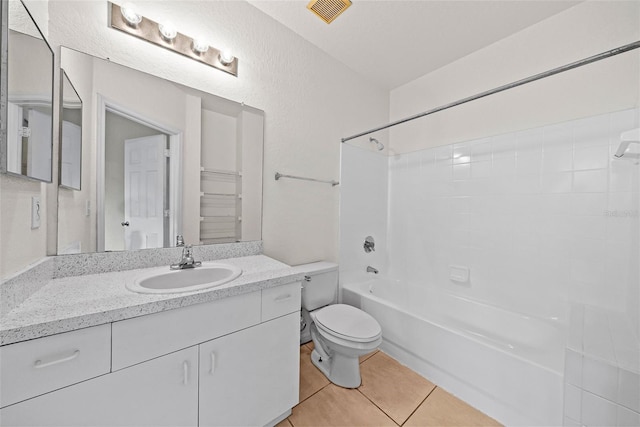 full bathroom with tile patterned flooring, bathing tub / shower combination, vanity, and toilet