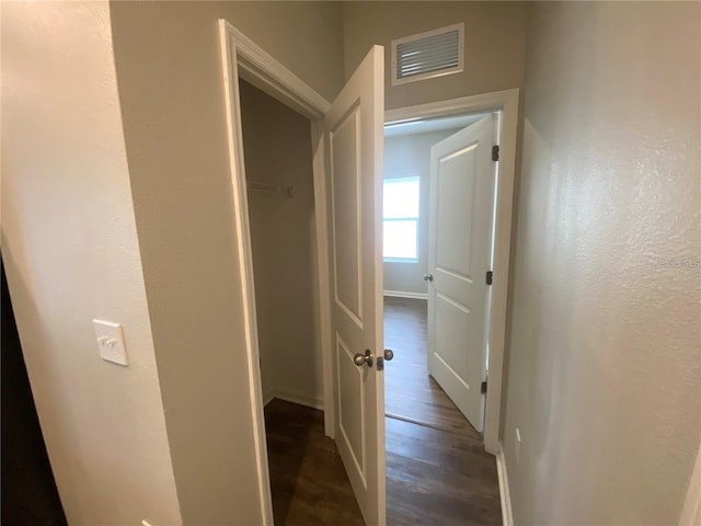 hall featuring dark wood-type flooring