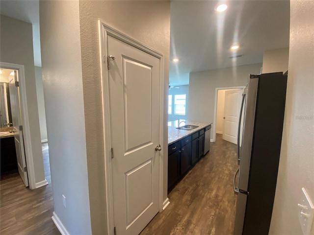 hall with sink and dark hardwood / wood-style flooring