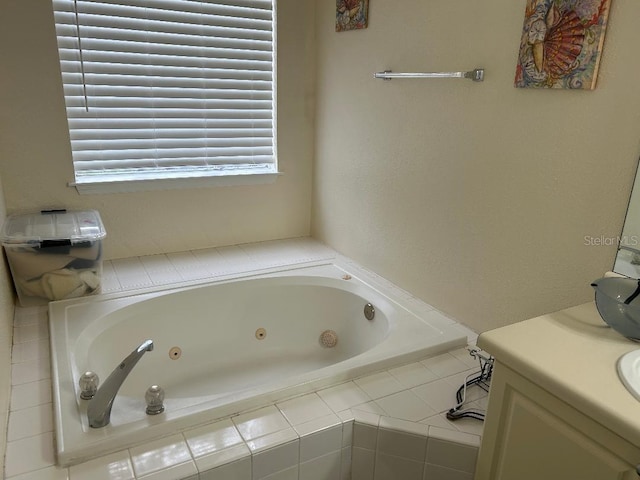 bathroom with tiled bath and vanity