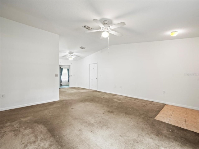 carpeted empty room featuring lofted ceiling and ceiling fan