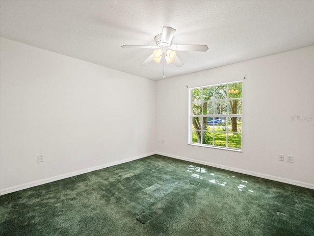 spare room featuring ceiling fan, carpet floors, and a textured ceiling