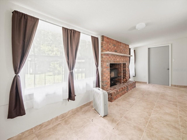 unfurnished living room featuring a fireplace