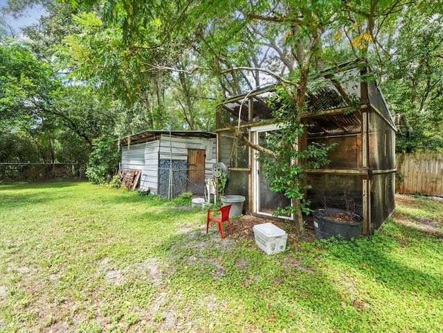 view of yard with an outdoor structure