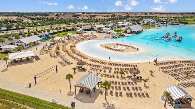 birds eye view of property featuring a view of the beach and a water view