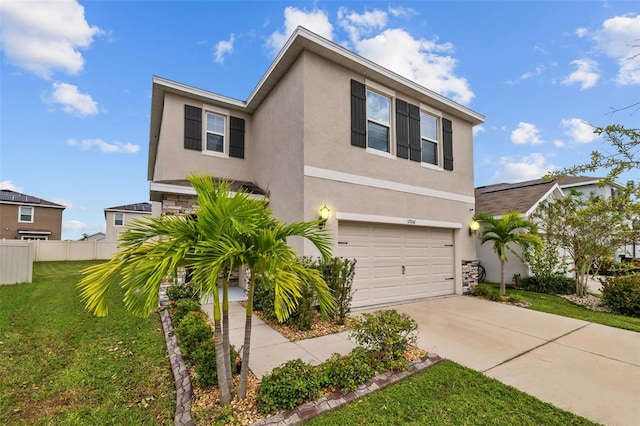 view of front of house featuring a garage and a front yard