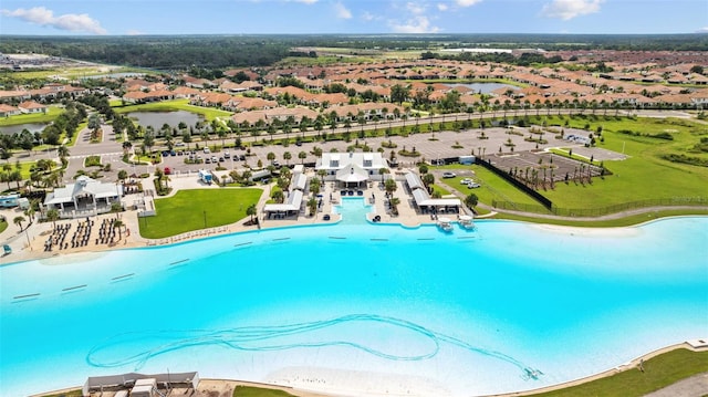 view of swimming pool with a water view