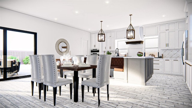 dining area featuring light hardwood / wood-style flooring and sink