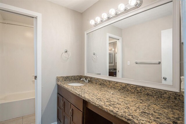 bathroom featuring vanity, shower with separate bathtub, and tile patterned floors