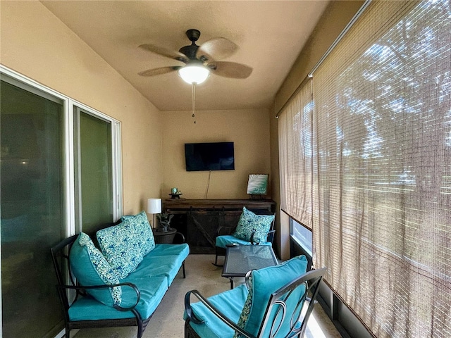 sunroom / solarium featuring ceiling fan