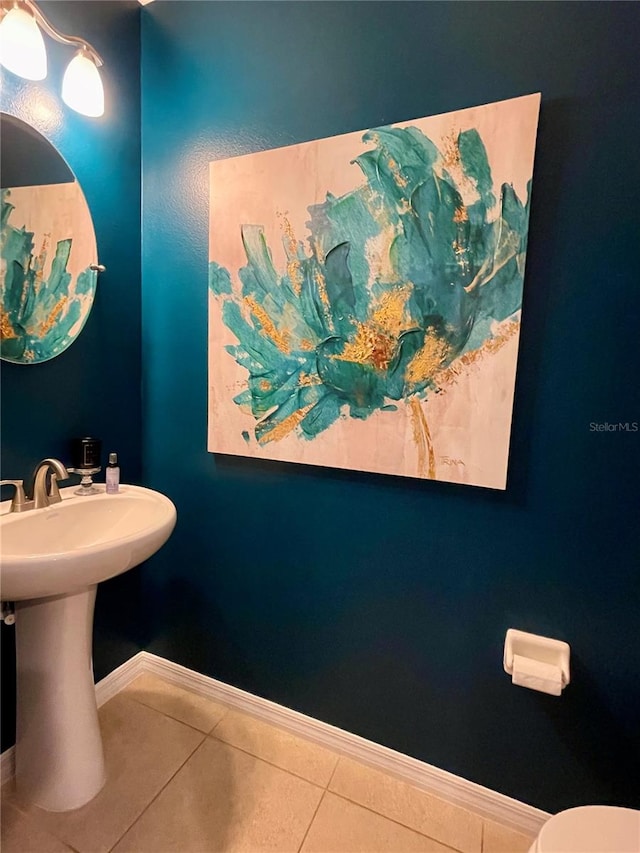 bathroom featuring tile patterned flooring and toilet