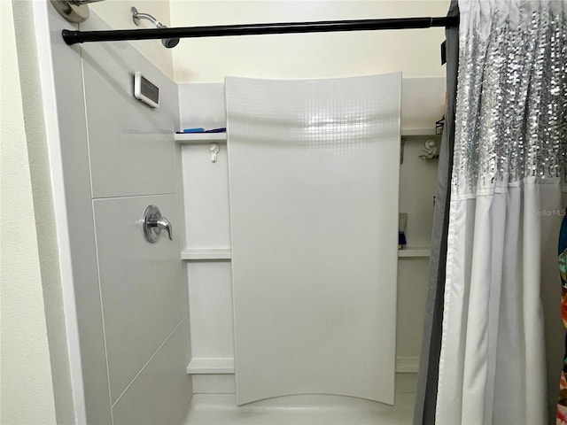 bathroom with tile patterned flooring and curtained shower