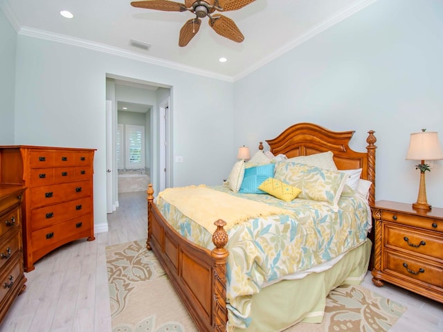 bedroom with ornamental molding, connected bathroom, light hardwood / wood-style floors, and ceiling fan