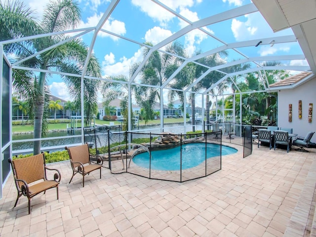 view of pool featuring a lanai, a patio, and a water view