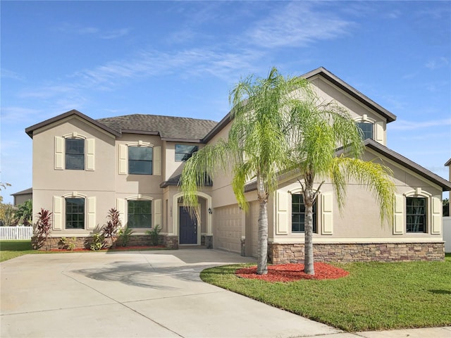 view of front of house featuring a garage and a front lawn