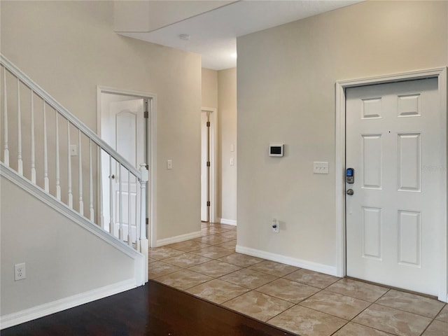 entrance foyer with light tile patterned floors